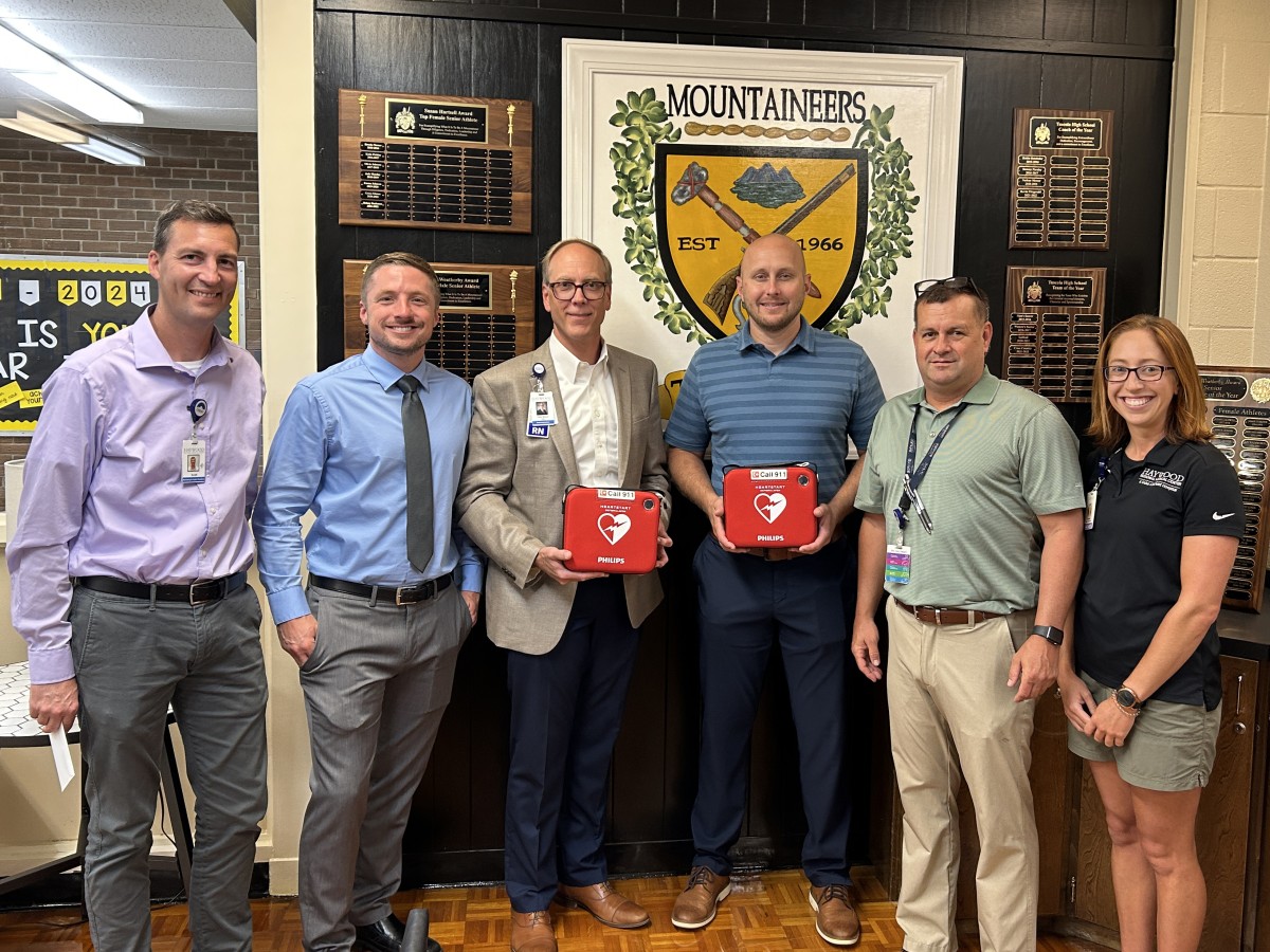 Haywood Sports Medicine and Tuscola High School representatives with AEDs